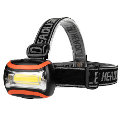 45-degree view of orange and black COB LED headlamp with adjustable elastic headband.