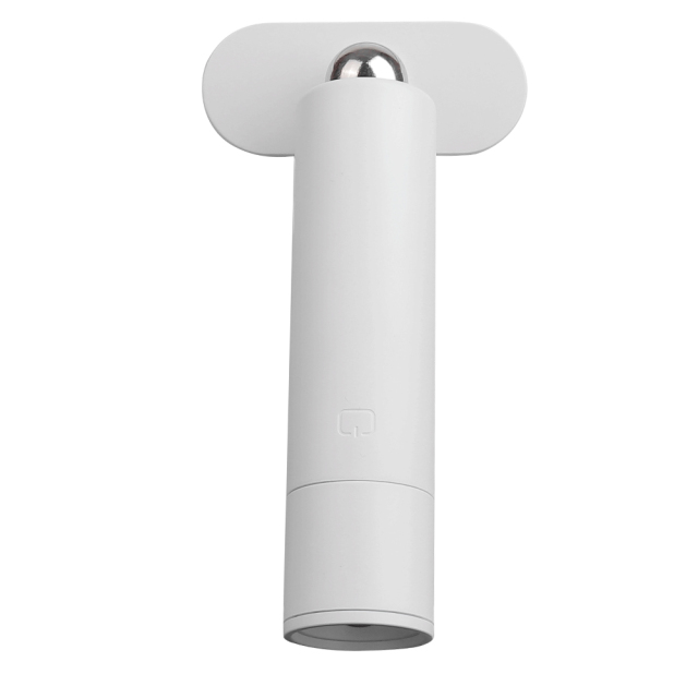 Wireless wall-mounted light head attached to a magnetic base for bedside use.