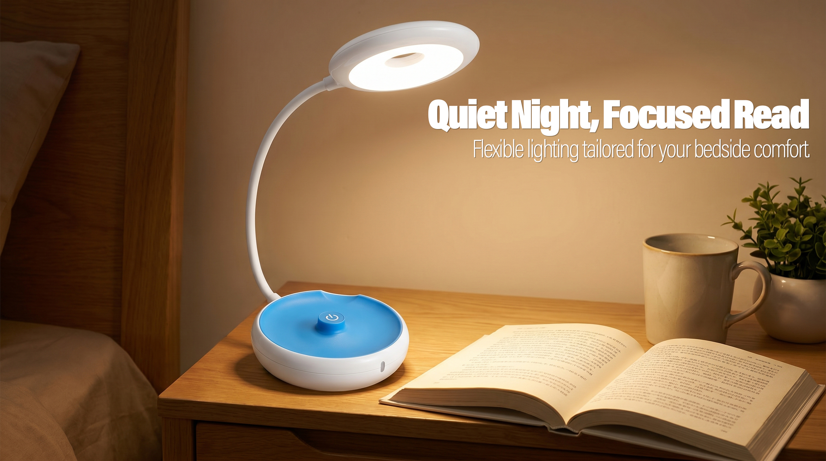 A white and blue ring-head LED desk lamp with a 360-degree flexible neck providing warm light for an open book on a wooden bedside nightstand.