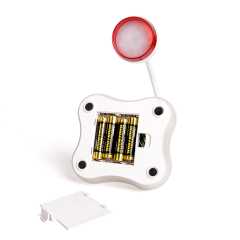 Internal battery compartment for 4xAAA batteries in a white LED desk lamp.