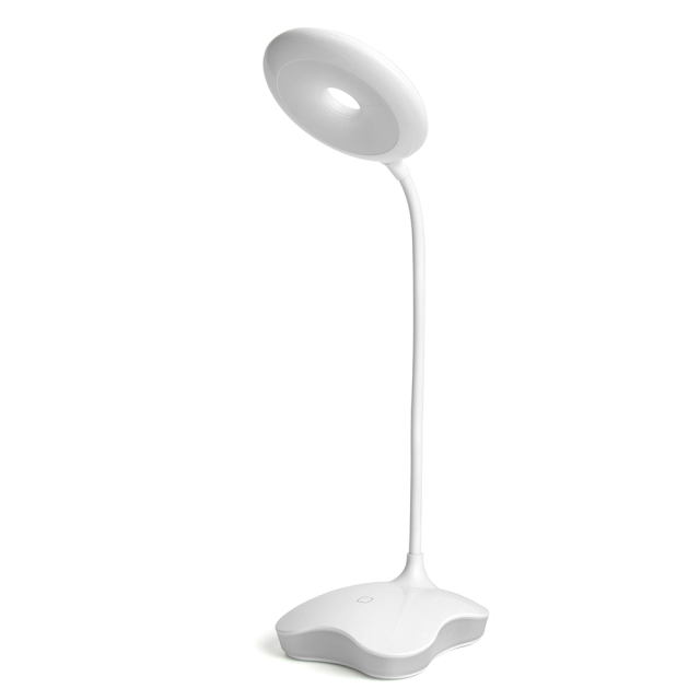 White ring-shaped LED desk lamp with warm night light base for bedroom.