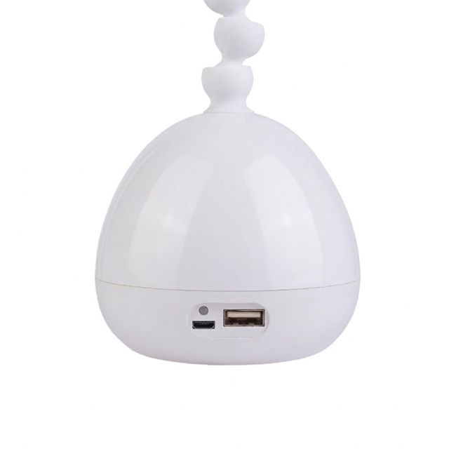 Detail of dual power LED desk lamp with USB DC port and 18650 battery compartment for continuous use.