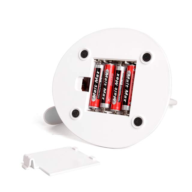 Bottom compartment of LED desk lamp showing space for 4xAAA batteries with cover removed