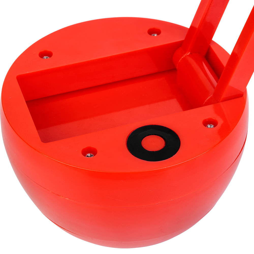 Detail shot of the press control switch on the red apple shaped LED desk lamp base