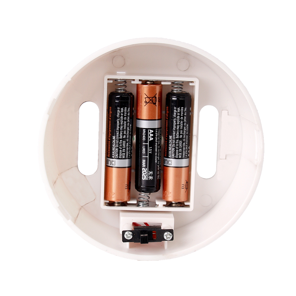 Bottom view of the LED lamp showing the 3xAAA battery compartment