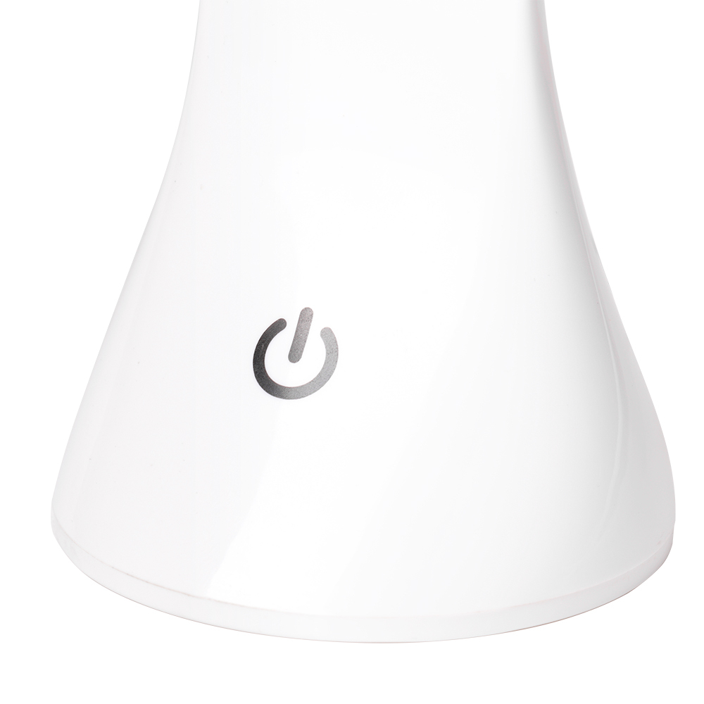 Detailed view of the touch sensor power switch on the base of the white desk lamp