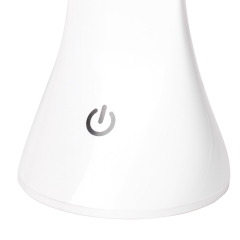 Detailed view of the touch sensor power switch on the base of the white desk lamp