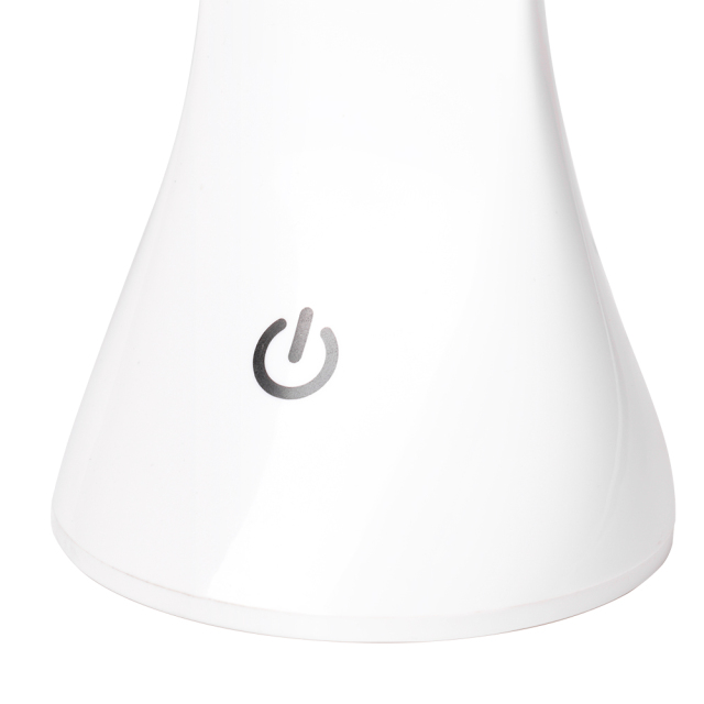 Detailed view of the touch sensor power switch on the base of the white desk lamp