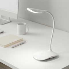 Minimalist white flexible gooseneck LED desk lamp with touch control on a bright office desk, emitting 5000K crisp white daylight for study and work.