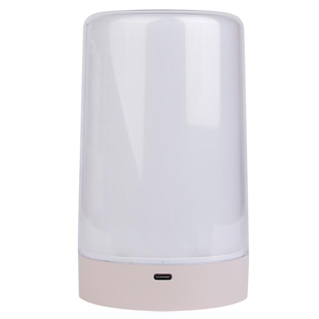 Front view of a minimalist white cylindrical LED night light showing the charging port on the base against a white background