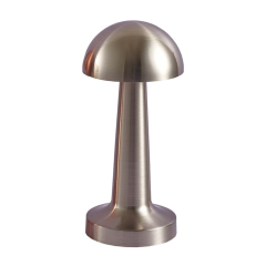 Front studio view of a brushed silver metal mushroom-shaped cordless table lamp on a white background