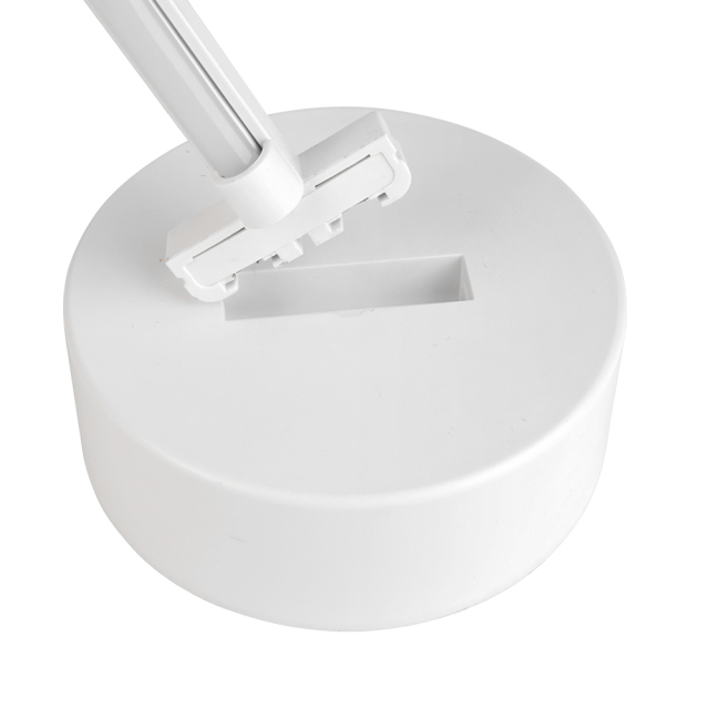 High-angle studio photograph displaying the detachable neon heart light tube being inserted into the slot of the circular base