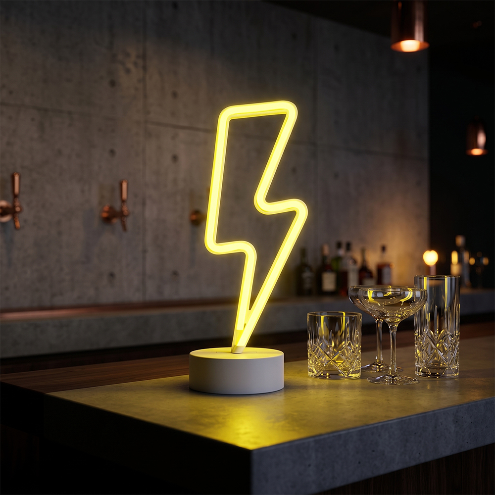 A yellow LED lightning bolt neon sign standing on a dark wooden bar counter next to crystal glasses in a lounge environment