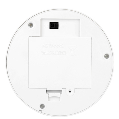 Bottom view of the circular neon night light base showing the smooth closed plastic compartment cover and power switch