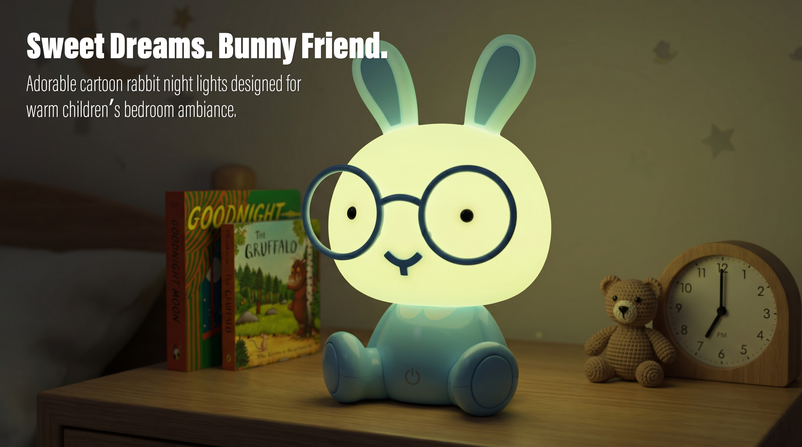 An illuminated cute cartoon rabbit silicone night light with glasses casting a warm glow next to a teddy bear on a bedside table in a cozy nursery scene.