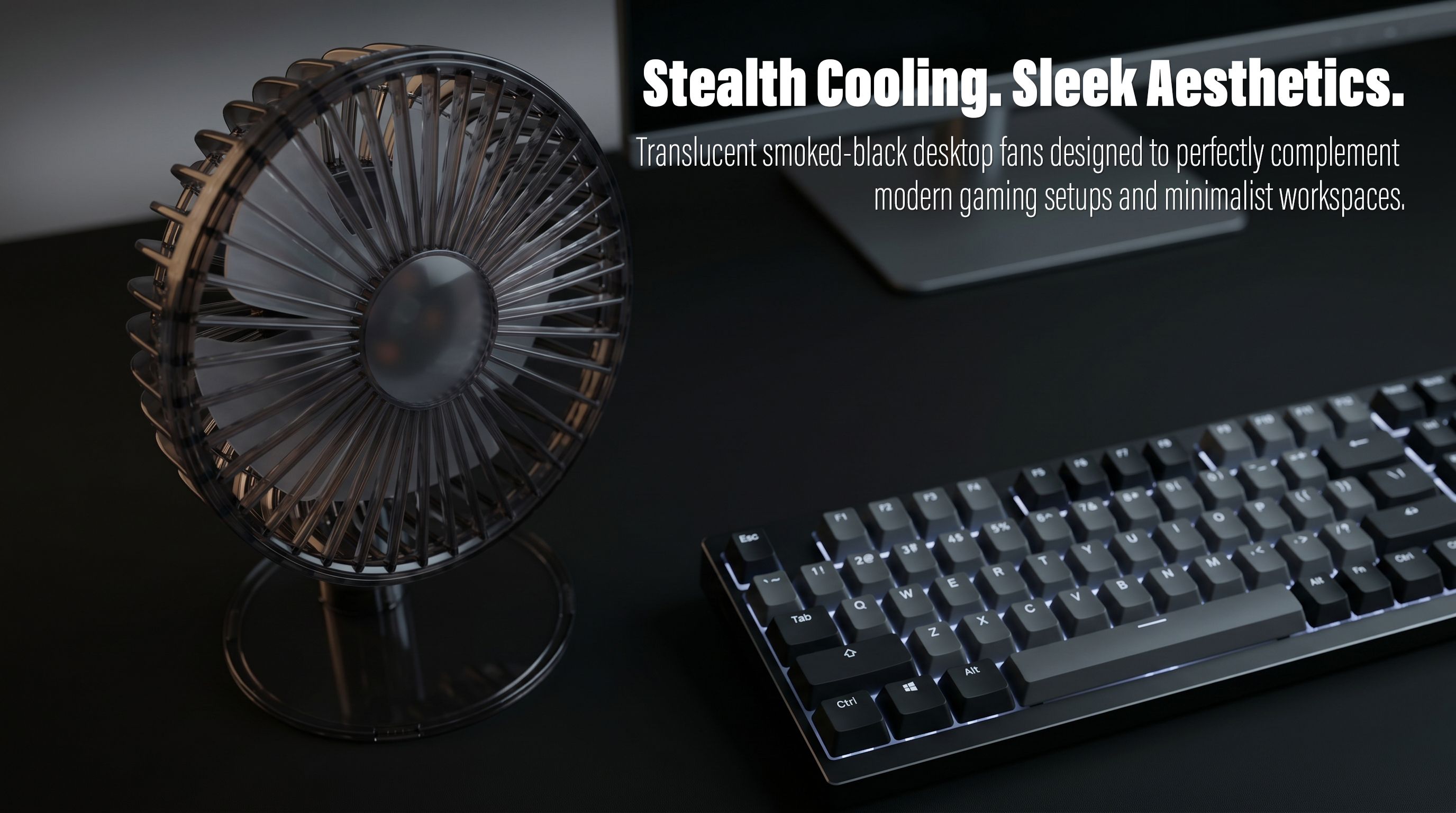 A stylish product photography of a smoked-black translucent desktop USB fan placed next to a backlit mechanical keyboard and a computer monitor on a sleek matte black desk setup.