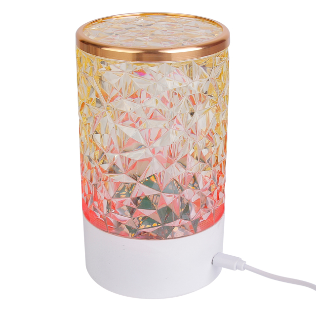 Rear side studio view of a rechargeable crystal table lamp showing a power cable connected to its charging port