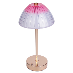 High-angle studio view of an elegant retro umbrella desk lamp showcasing the glossy metallic stem and pink transparent shade