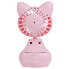 Rear studio view of the pink cartoon mini fan showing the back grill structure and the AAA battery compartment on the base.