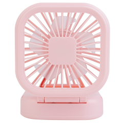 Front studio view of a compact pink rechargeable table fan with its head unfolded on a low base profile.