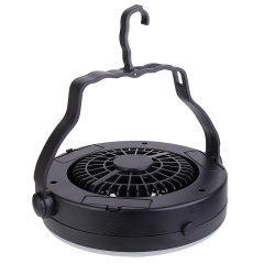 High-angle studio view of the black multi-functional tent fan resting flat to demonstrate its structural design.