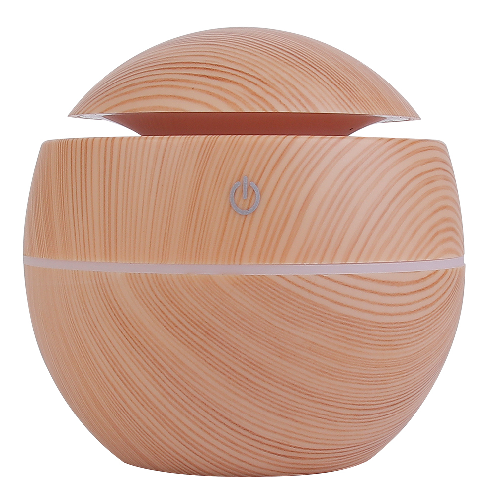 Front studio view of the ball-shaped ultrasonic aroma humidifier showing its natural wood texture, subtle middle light gap, and white power indicator.