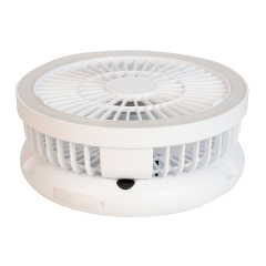 Side studio view of the white collapsible travel fan completely folded down into a compact cylindrical shape.