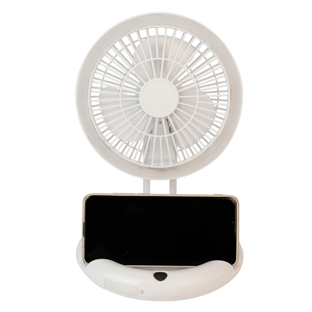Front studio view of the white desktop fan with a smartphone placed horizontally into the integrated base stand holder.
