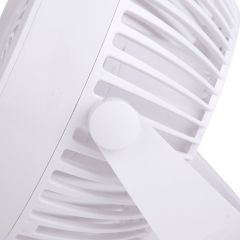 Profile side studio view of the white personal fan showing its sturdy clamp base and the adjustable hinge mechanism.