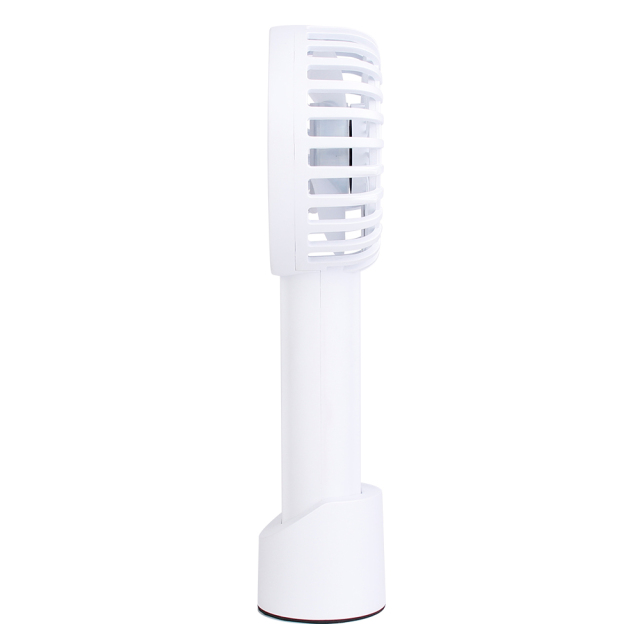 Profile side studio view of the white portable personal fan placed inside its detachable standing dock.