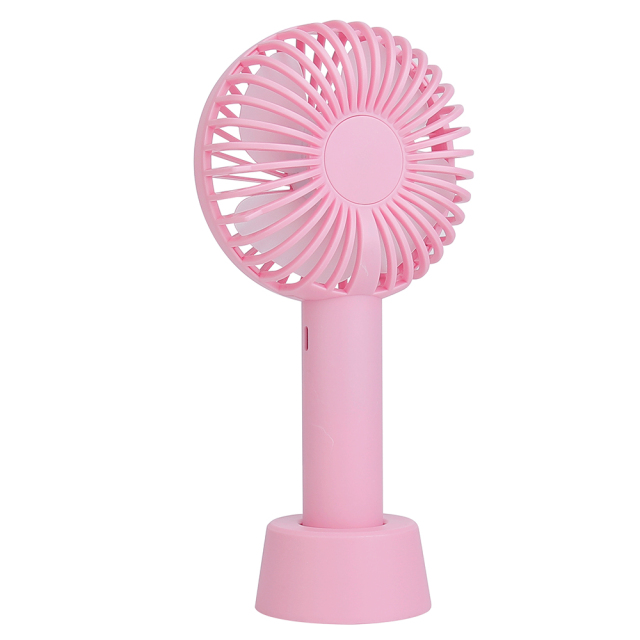 Three-quarter angled studio view of the pink portable pocket fan standing in its detachable desktop base.