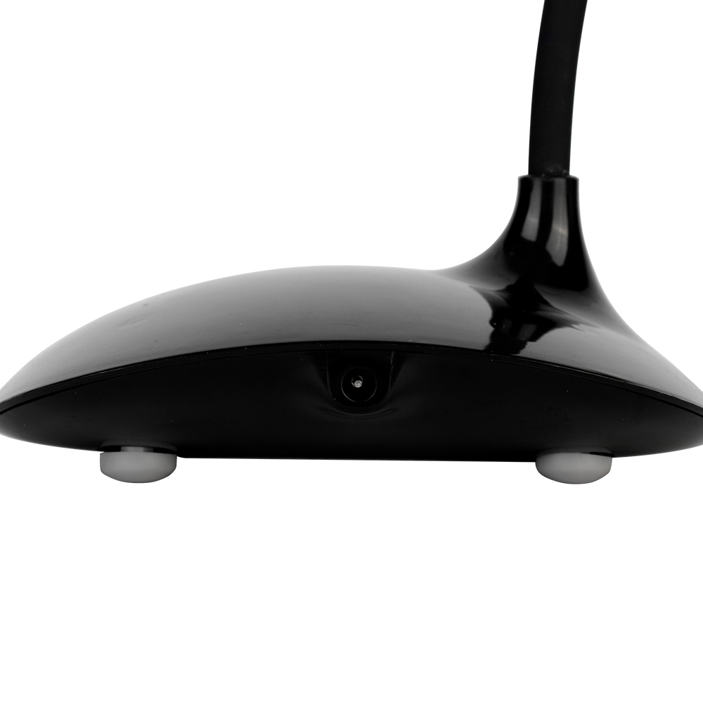 Rear flat view of the black desktop fan base showcasing the central DC power input interface and non-slip rubber feet.