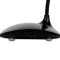 Rear flat view of the black desktop fan base showcasing the central DC power input interface and non-slip rubber feet.
