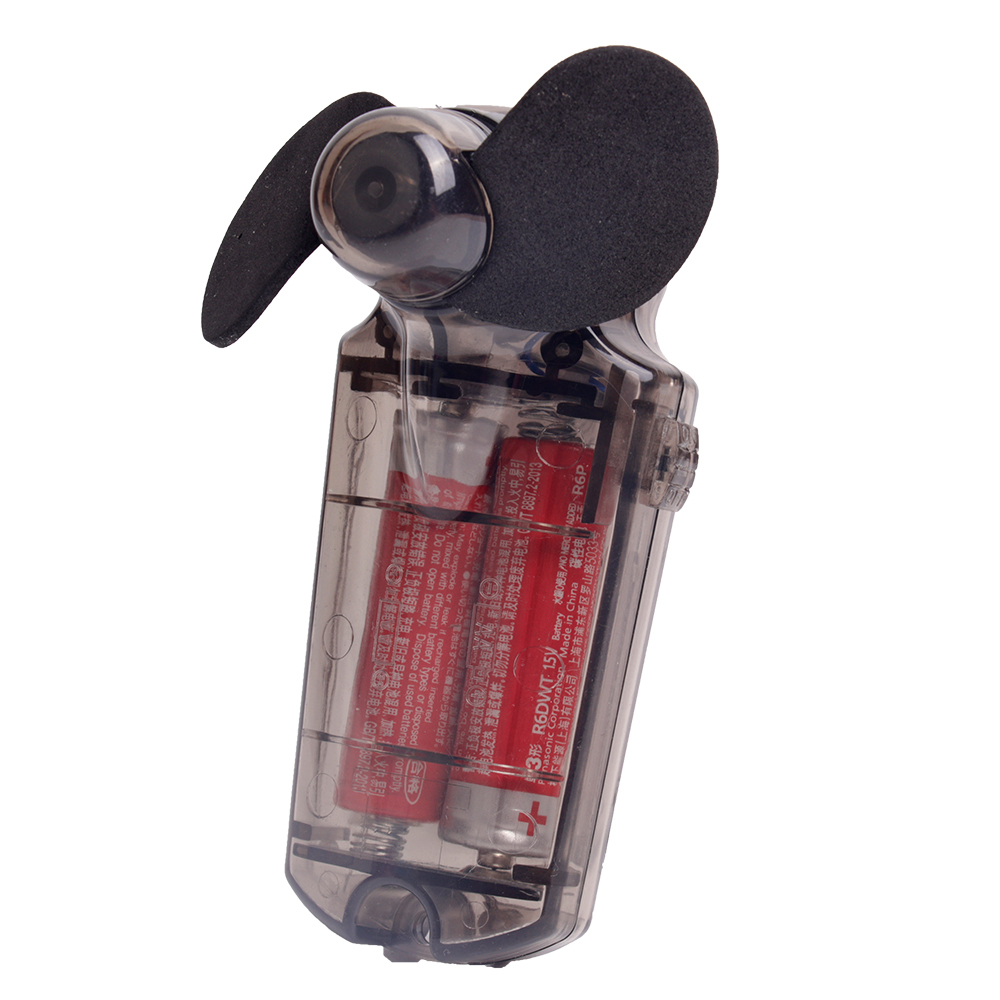 Three-quarter angled front studio view of the pocket-size personal fan with soft black blades and a clear smoky black body.