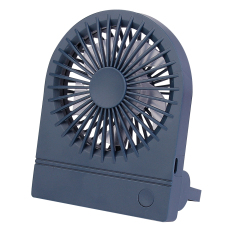 Three-quarter angled front studio view of the navy blue portable desktop fan standing upright with its support bracket.