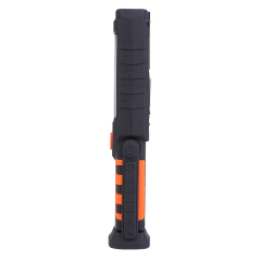 Side view profile of the handheld LED work light showing its ergonomic design and textured grip.