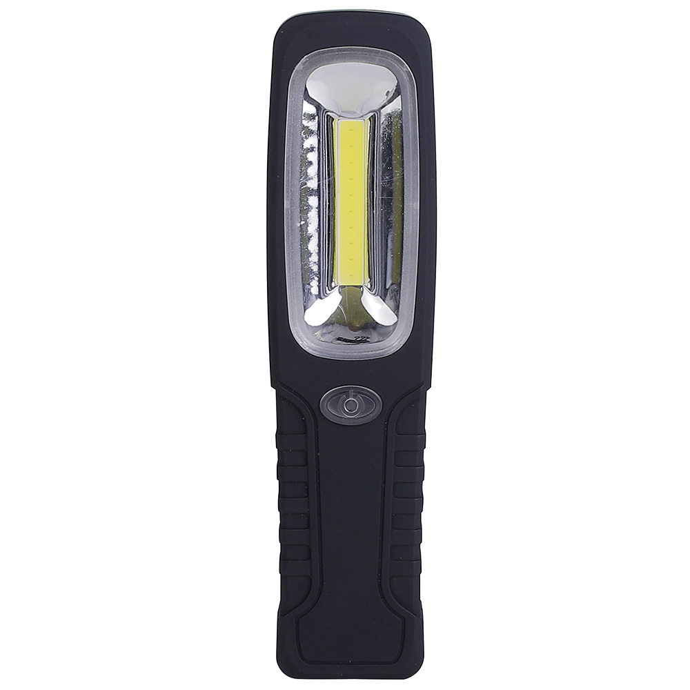 A black and red hands-free magnetic LED work light standing vertically on a rustic wooden workshop table with professional tools in the blurred background.