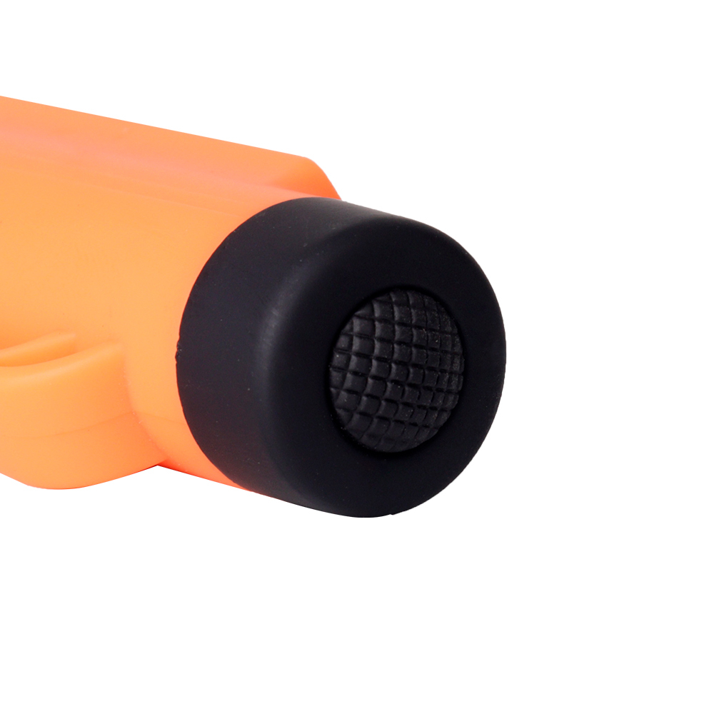 Close-up angled view looking down at the tail section of the orange model focusing on the black rubber power switch.
