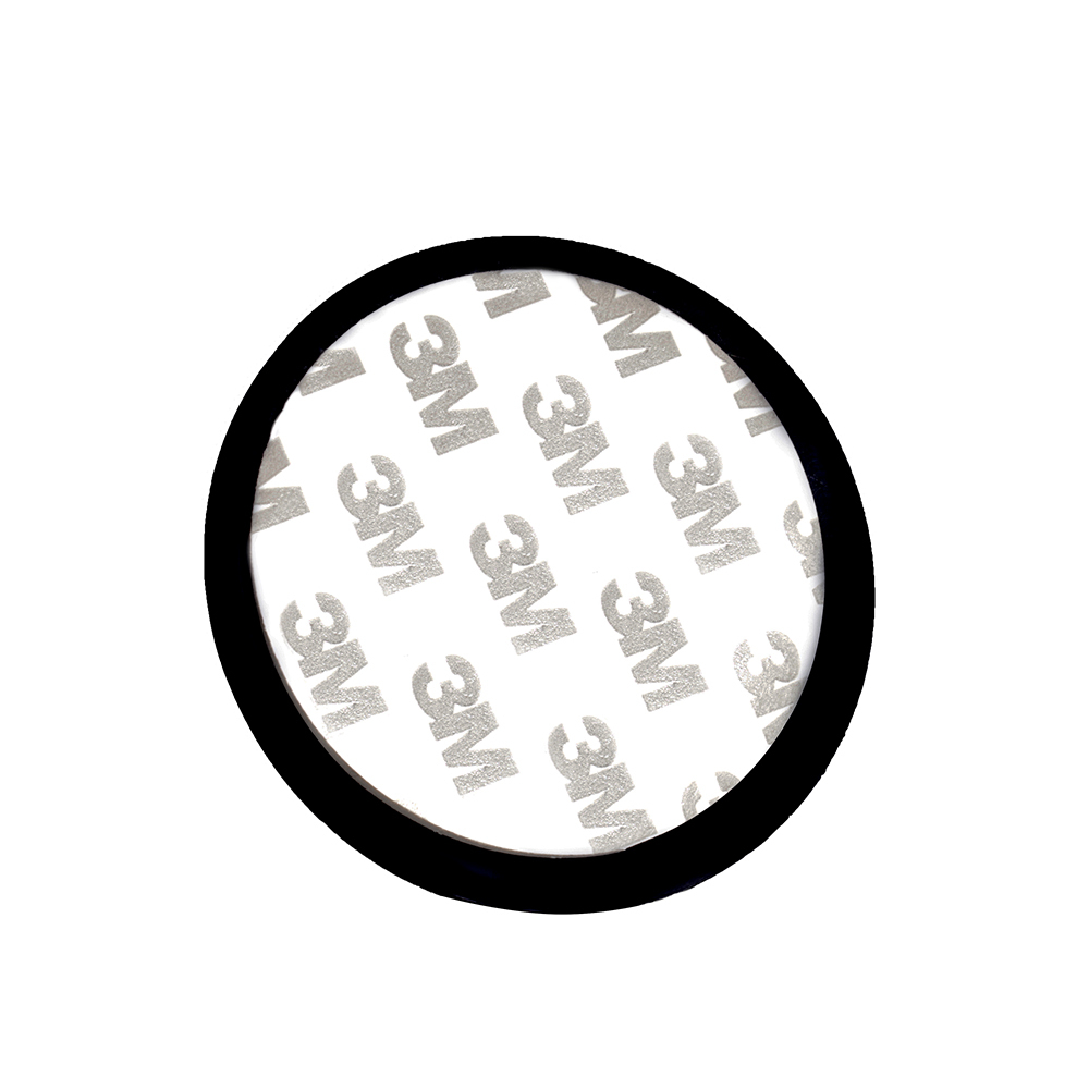 Close up view of a circular double-sided adhesive mounting tape pad featuring printed 3M logos.