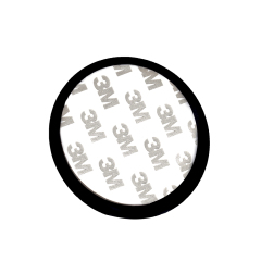 Close up view of a circular double-sided adhesive mounting tape pad featuring printed 3M logos.