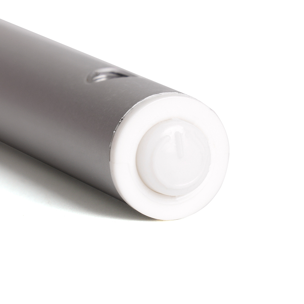 Close up view of the circular white plastic power switch button located at the tip of the silver light bar.