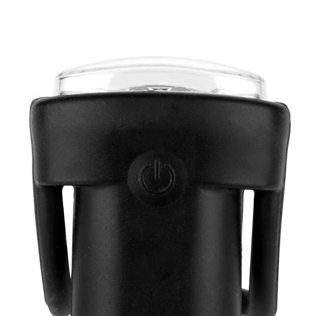 Close up top view of the black silicone casing, highlighting the raised circular power symbol switch button.