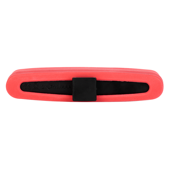 Rear view of the red silicone bike light housing, highlighting the central square black plastic mounting slot on a white background.