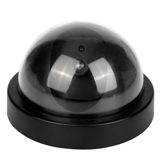 Perspective side view of the black dummy dome security camera featuring a black plastic base and a dark transparent sphere casing on a white background.