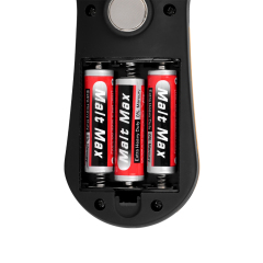 Close-up shot of the open battery compartment on the back of the light, showing three red AA batteries installed inside the slots.