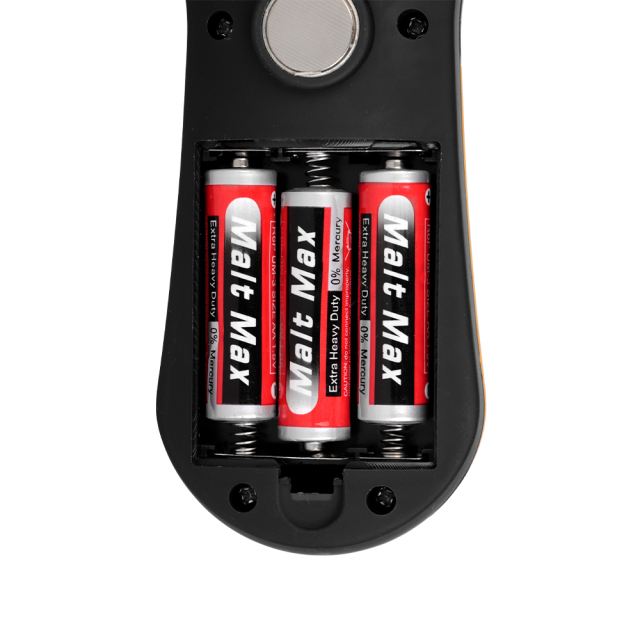 Close-up shot of the open battery compartment on the back of the light, showing three red AA batteries installed inside the slots.