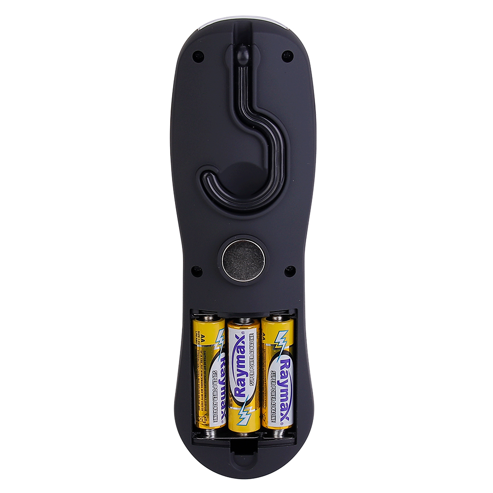 Rear view of the black light housing with the battery cover removed, displaying three yellow AA batteries loaded inside the compartment.