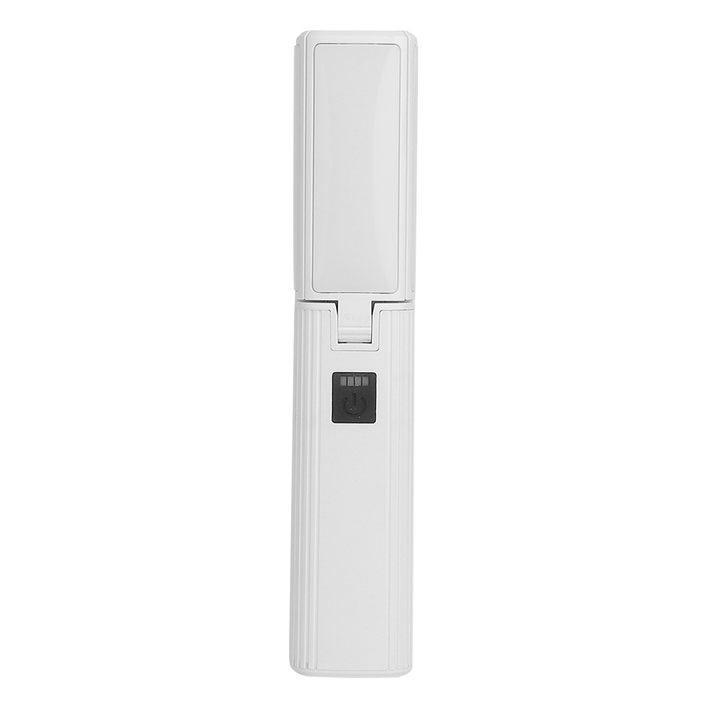 A straight-on front view of the white rectangular LED work light in its folded configuration, displaying the square black control button and battery level indicator area.