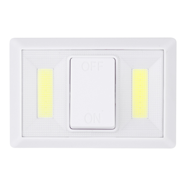 Straight-on front view of the white cordless closet light highlighting the central large rocker switch and dual vertical COB LED lighting panels.