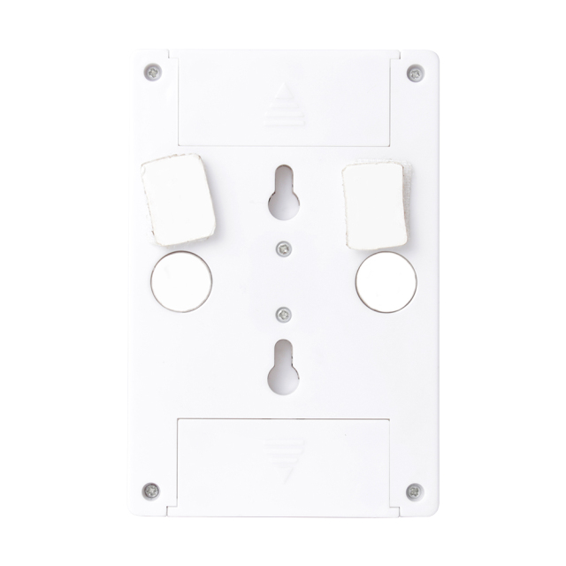 Rear view of the white switch light housing, showing the dual mounting setup with two circular magnets, two velcro pads, and integrated keyhole slots.